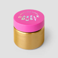 A gold jar with a bright pink lid labeled Antique Gold Edible Lustre Dust by Jenna Rae Cakes, set against a plain light gray background.