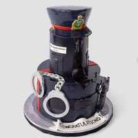 A cake decorated as a police uniform, featuring a hat, badge, handcuffs, walkie-talkie, and a belt. A white banner at the base reads CONGRATULATIONS! The cake is set against a plain background.