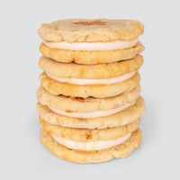 A $100 JRC Gift Bag from Jenna Rae Cakes is displayed against a plain light gray background.