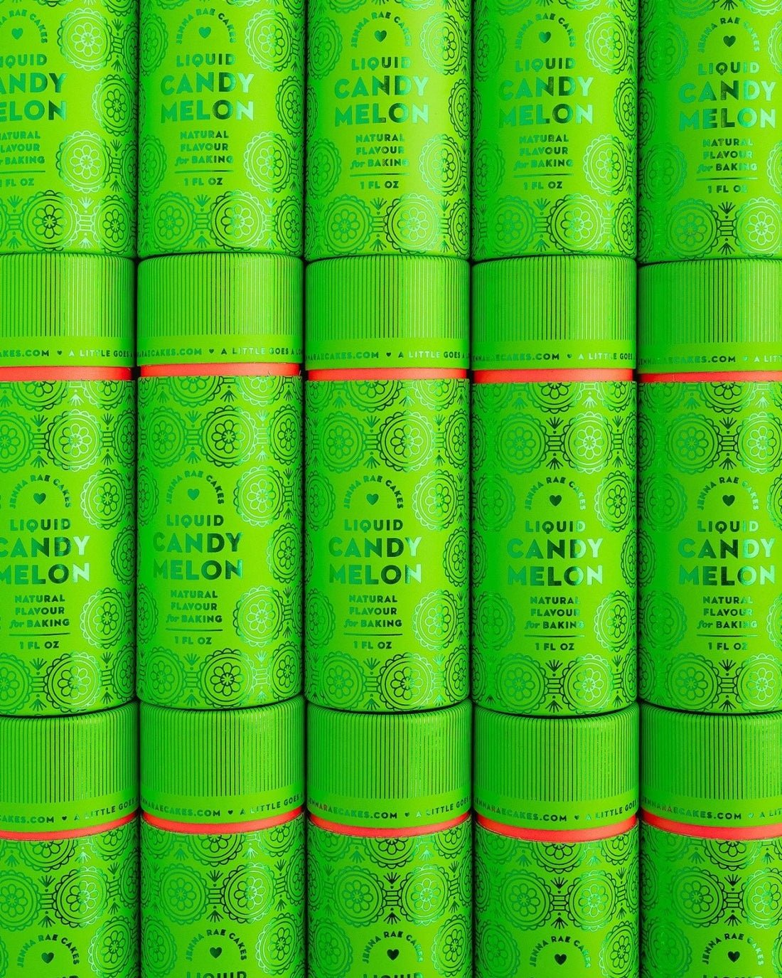 Packages of Jenna Rae Cakes Liquid Candy Melon, each containing six bright green cylinders with bold text and circular patterns, are stacked together to create a vibrant, repeating display.