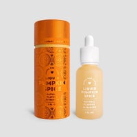 A small Jenna Rae Cakes Liquid Pumpkin Spice glass dropper bottle sits beside its tall, orange, pumpkin-patterned box. Both show theyre natural baking flavors, 1 fl oz each.