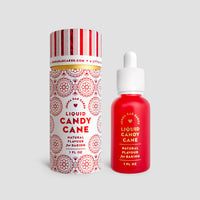 A red dropper bottle and cylindrical box labeled Jenna Rae Cakes Liquid Candy Cane, featuring white and red decorative patterns for baking, are shown against a plain gray background.