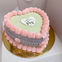 Design This Cake - Cake Size: Short | Cake Colour: Soft Sage Green | Piping Style: Fancy | 2 Piping Colours: Soft Pink +  Lavender | Make It Sparkle! | Add Heart Greeting Plaque