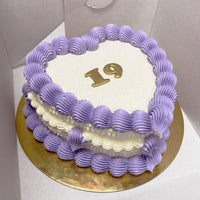 Design This Cake:  Cake Size: Short | Cake Colour: White | Piping Style: Fancy | 2 Piping Colours: Lavender + White | Make It Sparkle! | Add Gold Lettering