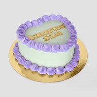 Design This Cake - Cake Size: Short | Cake Colour: Soft Sage Green | Piping Style: Simple | Piping Colour: Lavender | Add Gold Lettering