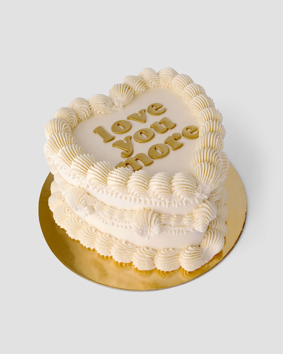 Design This Cake- Cake Size: Tall | Cake Colour: White | Piping Style: Fancy | Piping Colours: White | Add Gold Lettering